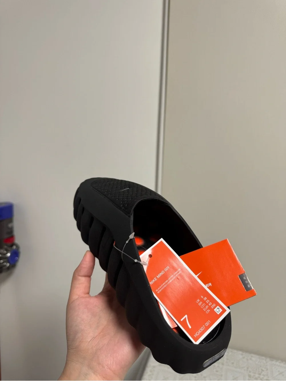 Brand new!They run SMALL! Nike Black Slip-On Mule with Bright Orange Studded Sol